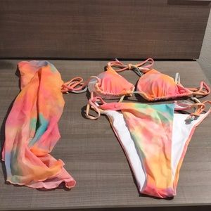 I’m am selling a 3pc (orange, blue, green, yellow, pink , & purple) swim set.